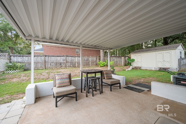 view of patio with central air condition unit and a storage shed