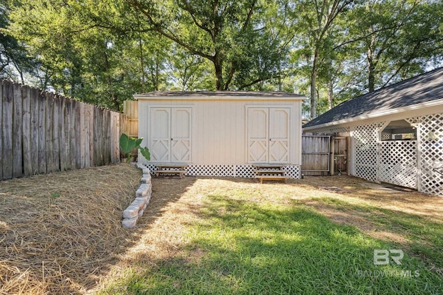 view of outbuilding featuring a lawn