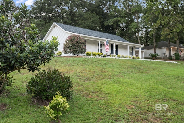 single story home featuring a front yard and covered porch