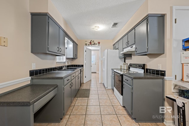 kitchen with white range with electric cooktop, gray cabinetry, and a textured ceiling