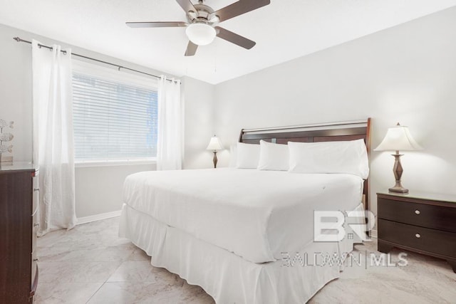 561 E Beach Blvd Unit 208, Gulf Shores, AL 36542 - bedroom with baseboards, ceiling fan, and marble finish floor