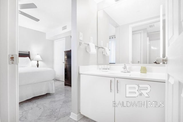 561 E Beach Blvd Unit 208, Gulf Shores, AL 36542 - ensuite bathroom with ceiling fan, vanity, marble finish floor, ensuite bathroom, and visible vents