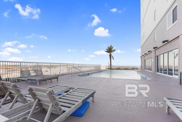 561 E Beach Blvd Unit 208, Gulf Shores, AL 36542 - community pool with a patio area