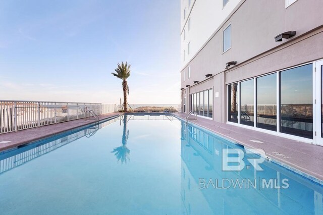 561 E Beach Blvd Unit 208, Gulf Shores, AL 36542 - pool with fence
