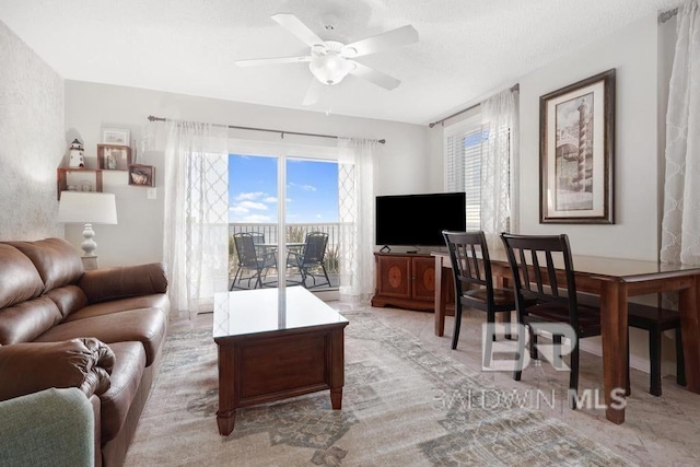 living room featuring ceiling fan