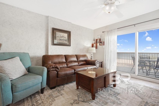 561 E Beach Blvd Unit 208, Gulf Shores, AL 36542 - living room featuring ceiling fan