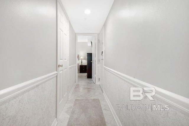 561 E Beach Blvd Unit 208, Gulf Shores, AL 36542 - hallway with marble finish floor