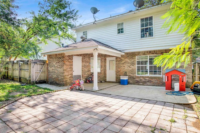 back of property featuring a patio