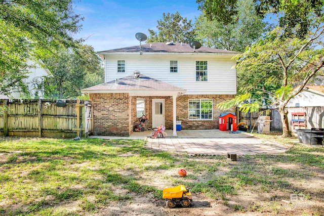 back of property featuring a patio