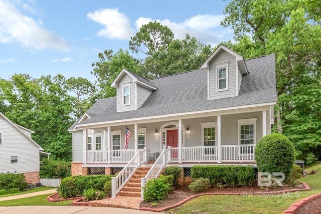 1509 Ridgeland Rd, Mobile, AL 36695 - cape cod home with a porch, roof with shingles, and stairway