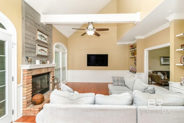 1509 Ridgeland Rd, Mobile, AL 36695 - living room featuring a fireplace, wood finished floors, ceiling fan, lofted ceiling, and built in features