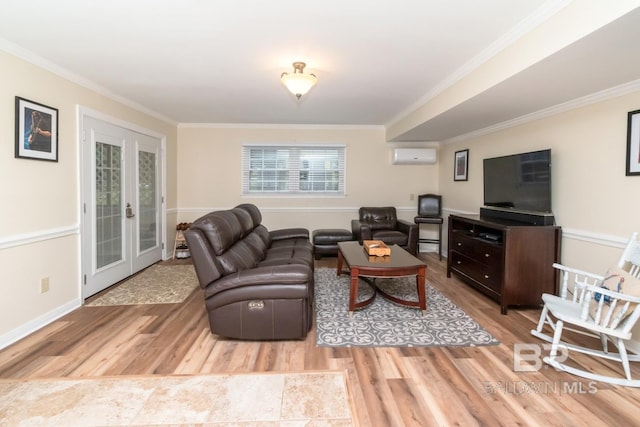 1509 Ridgeland Rd, Mobile, AL 36695 - living area featuring a wall mounted AC, wood finished floors, ornamental molding, and french doors