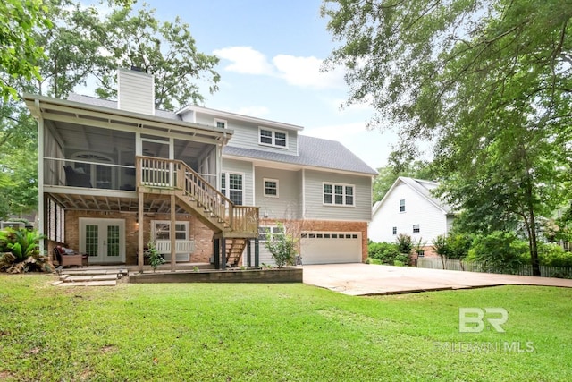 1509 Ridgeland Rd, Mobile, AL 36695 - rear view of property with a sunroom, french doors, brick siding, an attached garage, and stairs