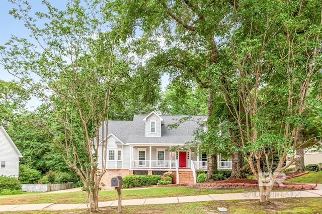 1509 Ridgeland Rd, Mobile, AL 36695 - cape cod-style house with covered porch and a front lawn