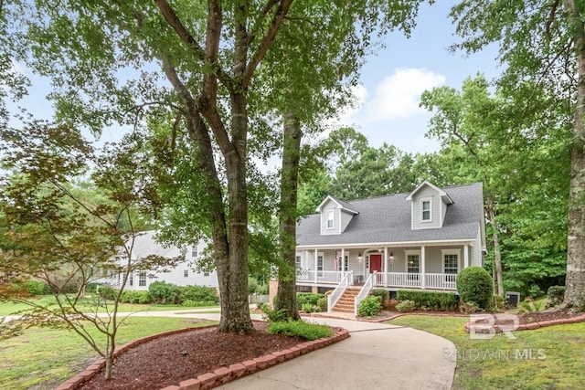 1509 Ridgeland Rd, Mobile, AL 36695 - cape cod house with covered porch, stairs, a front lawn, and roof with shingles