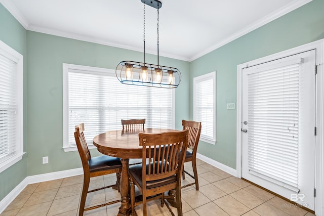 tiled dining room featuring a notable chandelier and ornamental molding