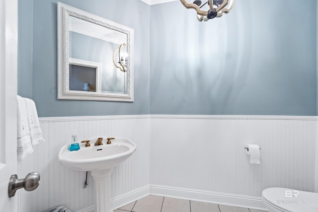 bathroom featuring tile patterned flooring and toilet