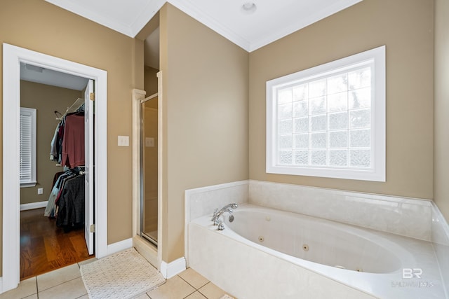 bathroom featuring crown molding, tile patterned flooring, and plus walk in shower