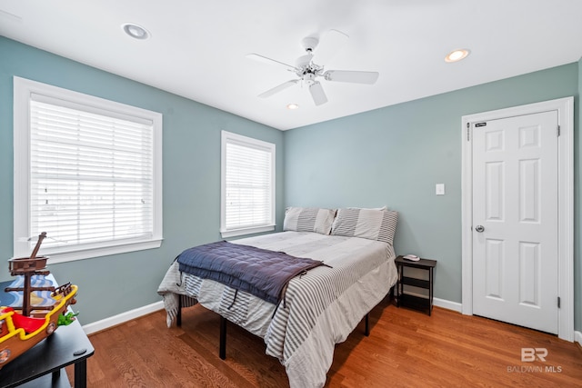 bedroom featuring ceiling fan and hardwood / wood-style flooring