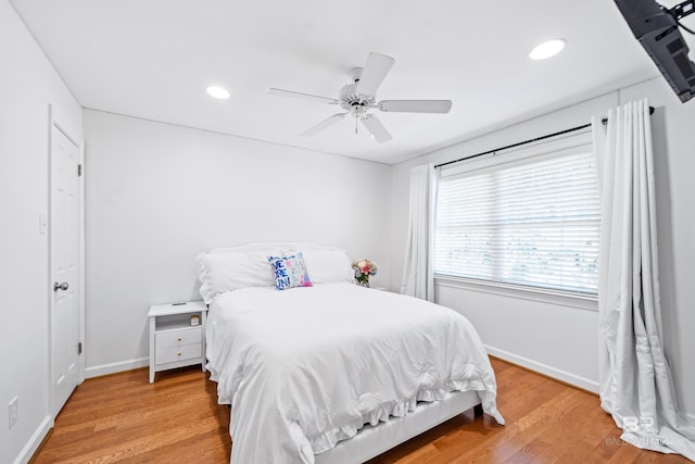 bedroom featuring ceiling fan and hardwood / wood-style flooring