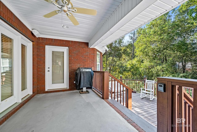 view of patio with grilling area, ceiling fan, and a wooden deck