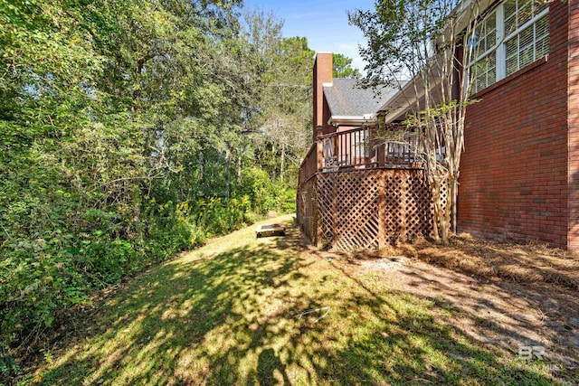 view of yard featuring a wooden deck