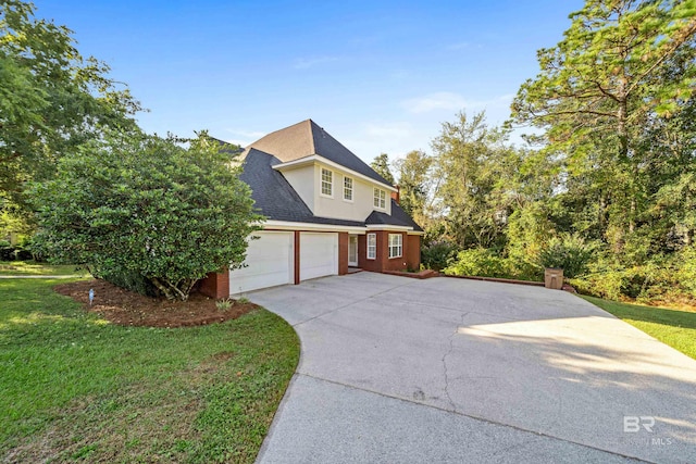 view of side of home with a lawn