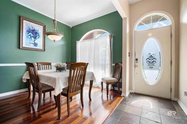2856 W Saddlebrook Dr, Mobile, AL 36695 - dining room featuring stone tile flooring, baseboards, ornamental molding, and plenty of natural light
