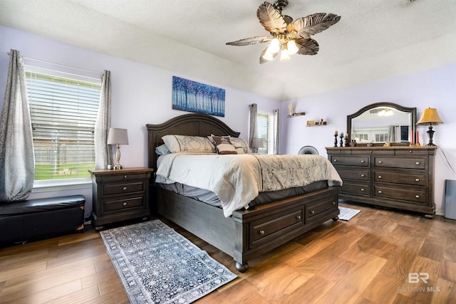 2856 W Saddlebrook Dr, Mobile, AL 36695 - bedroom featuring light wood-type flooring, a textured ceiling, and ceiling fan