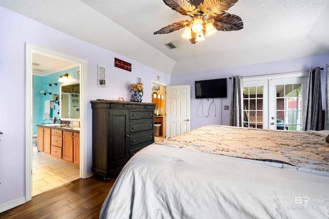 2856 W Saddlebrook Dr, Mobile, AL 36695 - bedroom featuring french doors, dark wood-style flooring, vaulted ceiling, visible vents, and ensuite bath