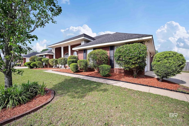 2856 W Saddlebrook Dr, Mobile, AL 36695 - view of front of house with a shingled roof and a front lawn