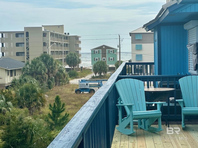 balcony featuring a deck with water view