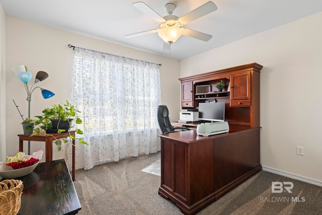 home office with baseboards, carpet, and ceiling fan