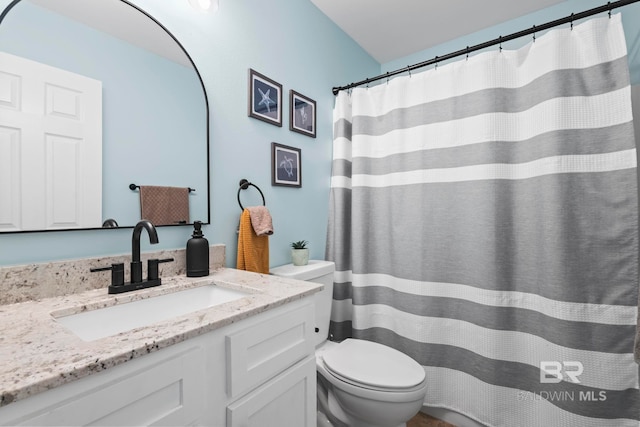 bathroom with vanity and toilet