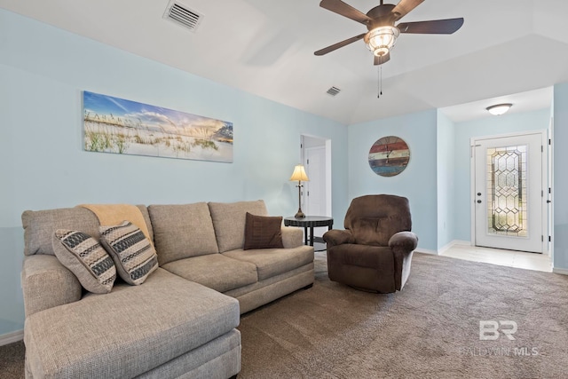 living room with lofted ceiling, carpet flooring, baseboards, and visible vents