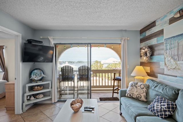 930 W Beach Blvd Unit 202, Gulf Shores, AL 36542 - tiled living room with a textured ceiling and wooden walls