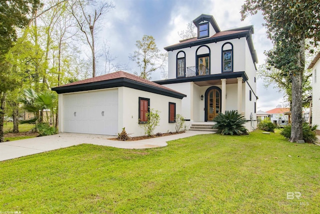 13897 Fish River Acres Cir, Foley, AL 36535 - view of front facade with stucco siding, driveway, a front yard, a garage, and a balcony