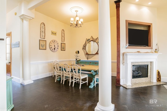 13897 Fish River Acres Cir, Foley, AL 36535 - dining space with ornate columns, finished concrete flooring, a high end fireplace, and a chandelier