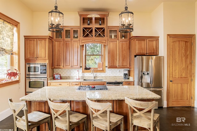 13897 Fish River Acres Cir, Foley, AL 36535 - kitchen with appliances with stainless steel finishes, a chandelier, backsplash, a sink, and healthy amount of natural light