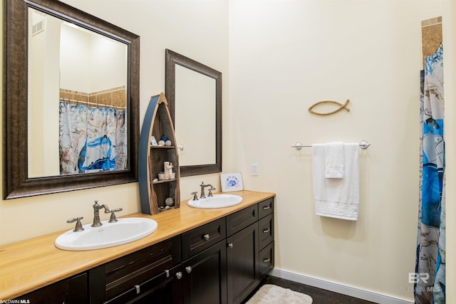 13897 Fish River Acres Cir, Foley, AL 36535 - bathroom featuring double vanity and a shower with curtain