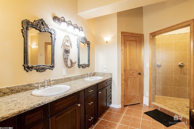 13897 Fish River Acres Cir, Foley, AL 36535 - bathroom with double vanity, a tile shower, and baseboards
