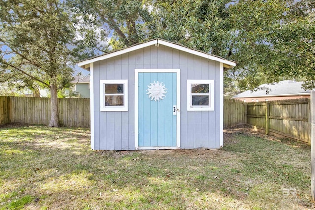 view of outdoor structure with a lawn