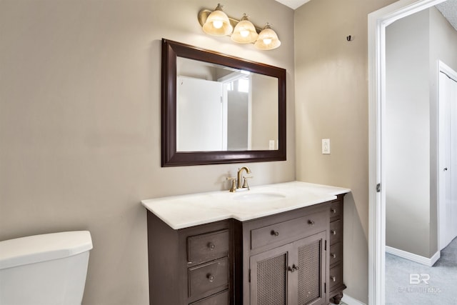 bathroom with vanity and toilet