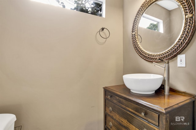 bathroom with vanity and toilet