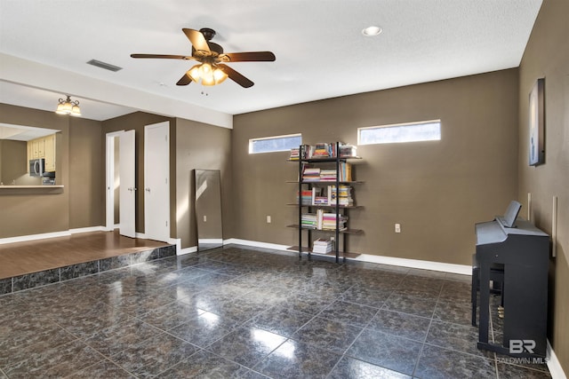 unfurnished room with ceiling fan