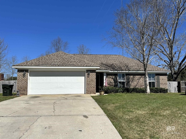 ranch-style house with fence, concrete driveway, a front yard, a garage, and brick siding