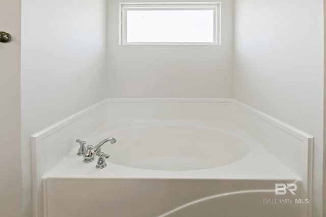 bathroom featuring a garden tub