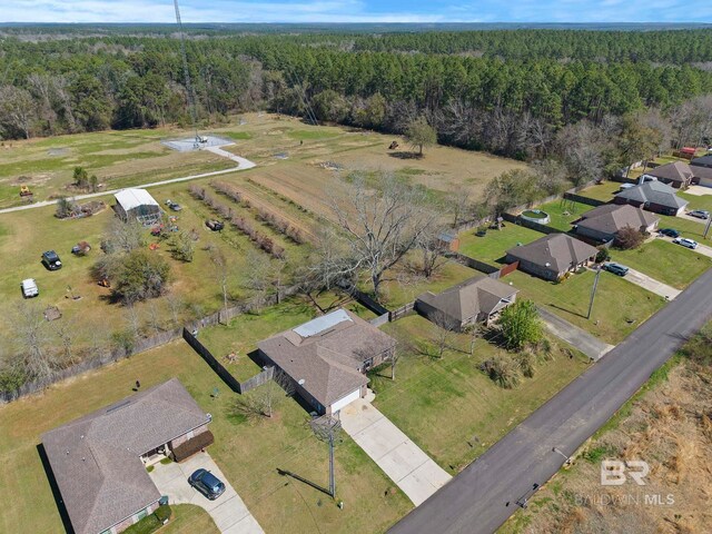 bird's eye view featuring a wooded view