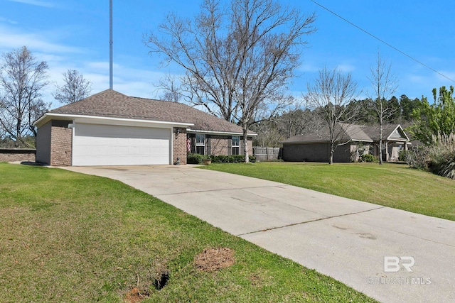 single story home with a front lawn, an attached garage, brick siding, and driveway