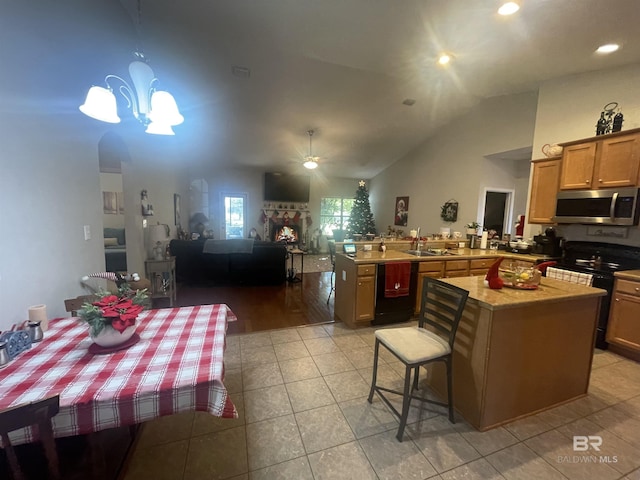 kitchen featuring dishwasher, electric range oven, kitchen peninsula, light hardwood / wood-style floors, and pendant lighting